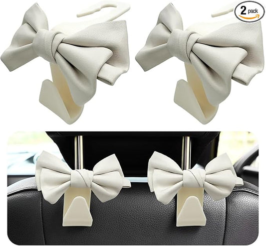 2 PCS Car Seat Headrest Hooks, Cute Bow Shaped Vehicle Backseat Storage Hooks, Leather Bow Shaped Sturdy Car Seat Back Hooks for Purses/Coats/Umbrellas, Car Accessories (White)