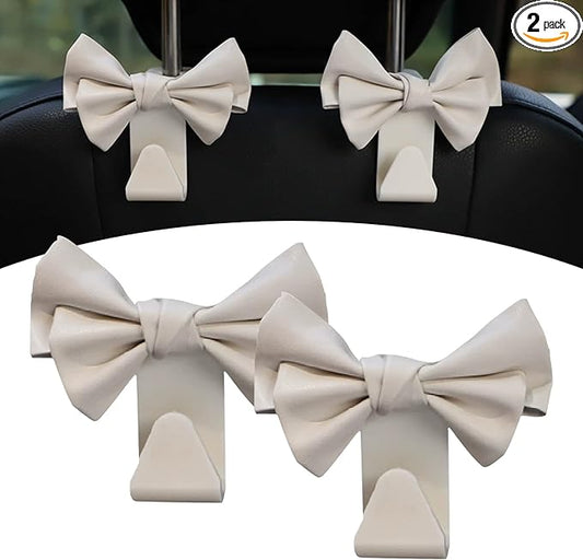 2 Pack Car Seat Headrest Hooks, Cute Bow Design Backseat Hook Storage Organizer for Purses, Handbags, Coats, Umbrellas, Cute Car Accessories for Women and Girls (White Leather)