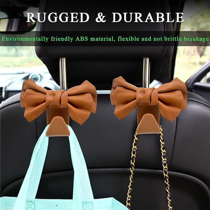 2 PCS Car Seat Headrest Hooks, Cute Bow Shaped Vehicle Backseat Storage Hooks, Leather Bow Shaped Sturdy Car Seat Back Hooks for Purses/Coats/Umbrellas, Car Accessories (Brown)