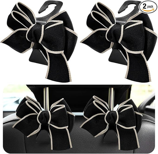 2 PCS Car Seat Headrest Hooks, Cute Bow Shaped Vehicle Backseat Storage Hooks, Leather Bow Shaped Sturdy Car Seat Back Hooks for Purses/Coats/Umbrellas, Car Accessories (White Edge)