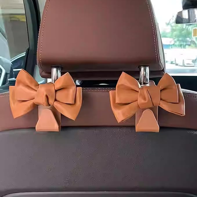 2 PCS Car Seat Headrest Hooks, Cute Bow Shaped Vehicle Backseat Storage Hooks, Leather Bow Shaped Sturdy Car Seat Back Hooks for Purses/Coats, Car Accessories (Brown)