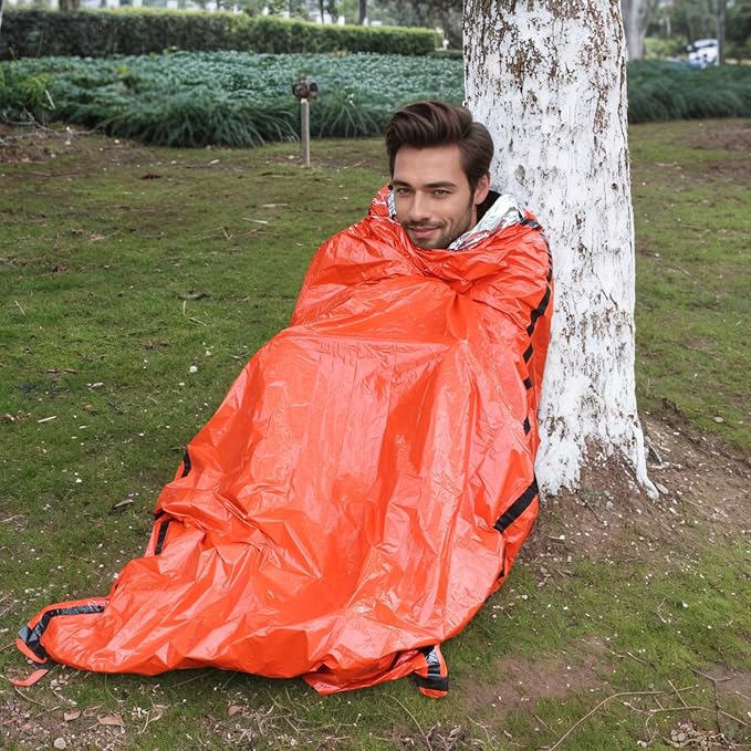 Emergency Sleeping Bags for Survival，2 Pack Bivvy Bag， Storage Bag with Whistle， Camping, Hiking Keep Warm, Outdoor Adventures